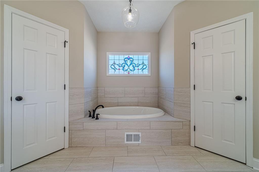 710 Youth Jersey Road Monroe, GA 30655 - Photo 29 of 53 a bathroom with a tub and shower