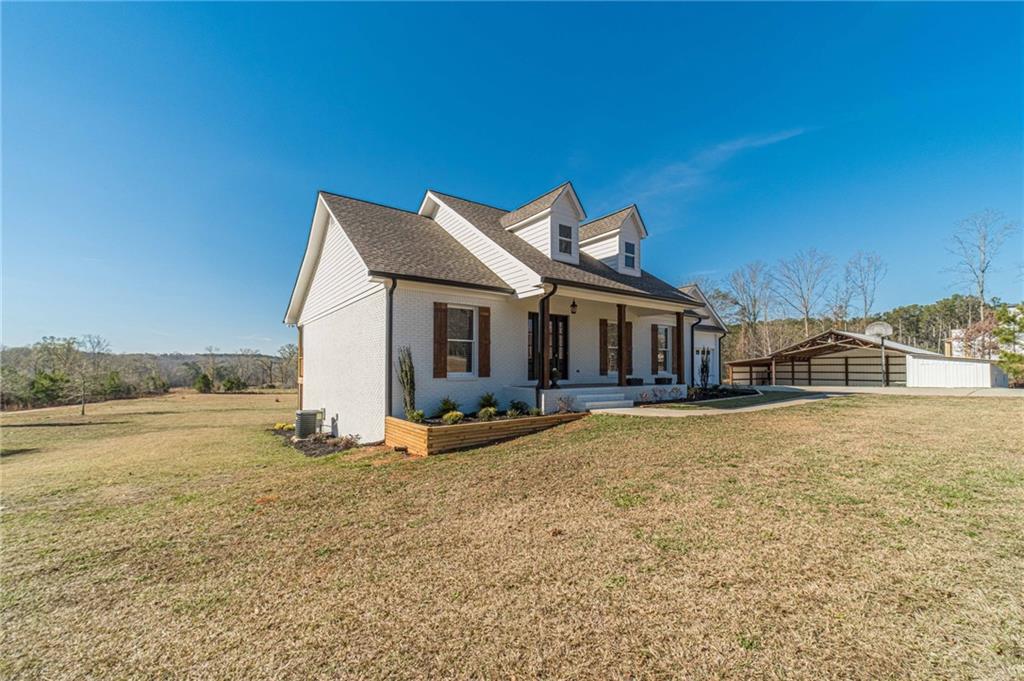 710 Youth Jersey Road Monroe, GA 30655 - Photo 3 of 53 a front view of a house with a yard