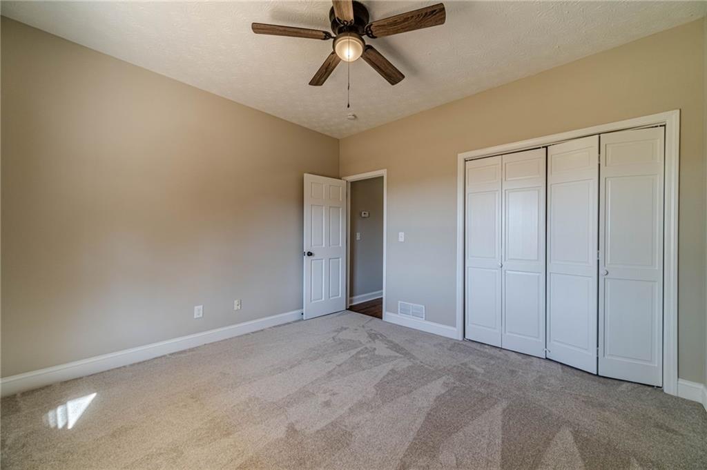 710 Youth Jersey Road Monroe, GA 30655 - Photo 41 of 53 a view of an empty room and chandelier fan