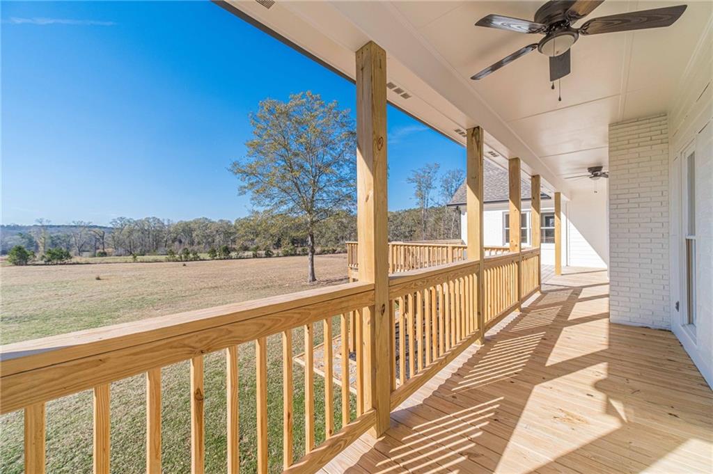 710 Youth Jersey Road Monroe, GA 30655 - Photo 46 of 53 a view of a balcony with furniture and a yard
