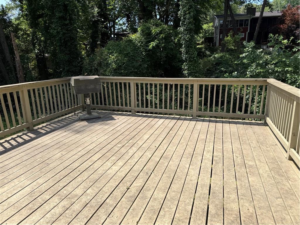 4707 Riverwood Circle Decatur, GA 30035 - Photo 16 of 17 a balcony with wooden floor and trees