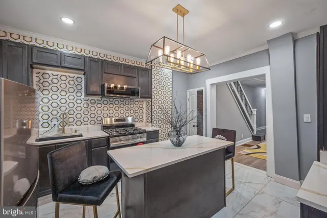 a kitchen with a dining table and chairs