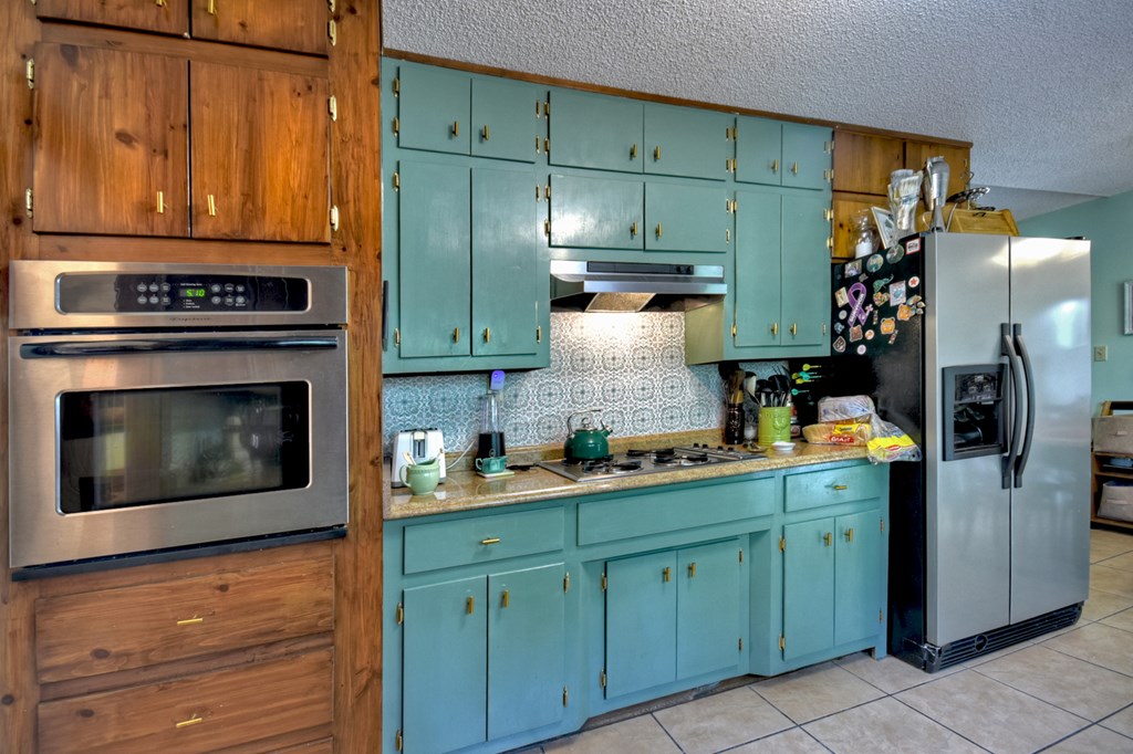 1359 Salem Road Mineral Bluff, GA 30559 - Photo 14 of 18 a kitchen with stainless steel appliances granite countertop a refrigerator and a stove top oven