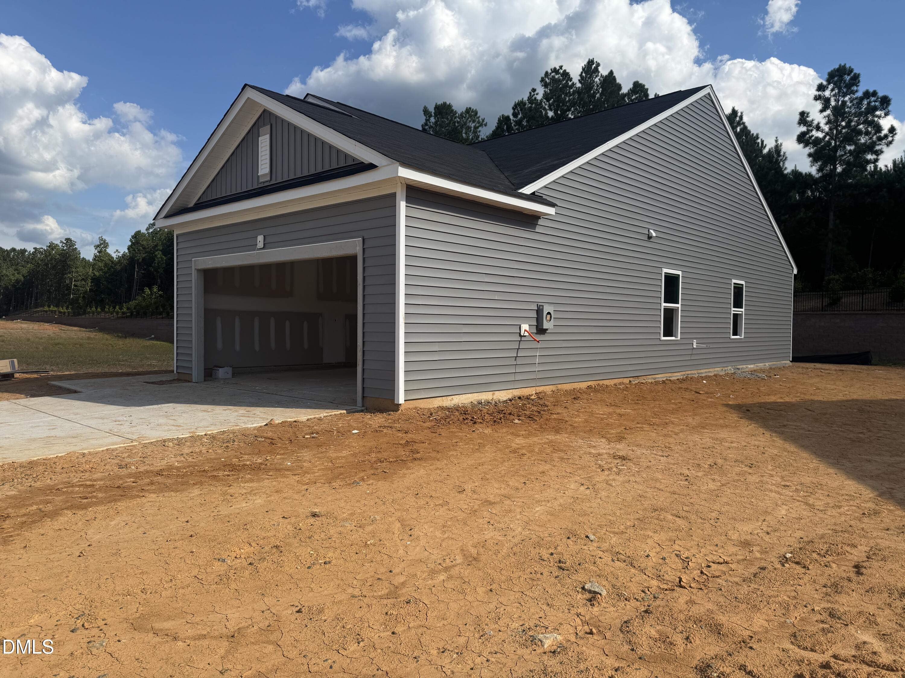 11739 Salers Loop Middlesex, NC 27557 - Photo 24 of 24 a view of a house with a yard and garage