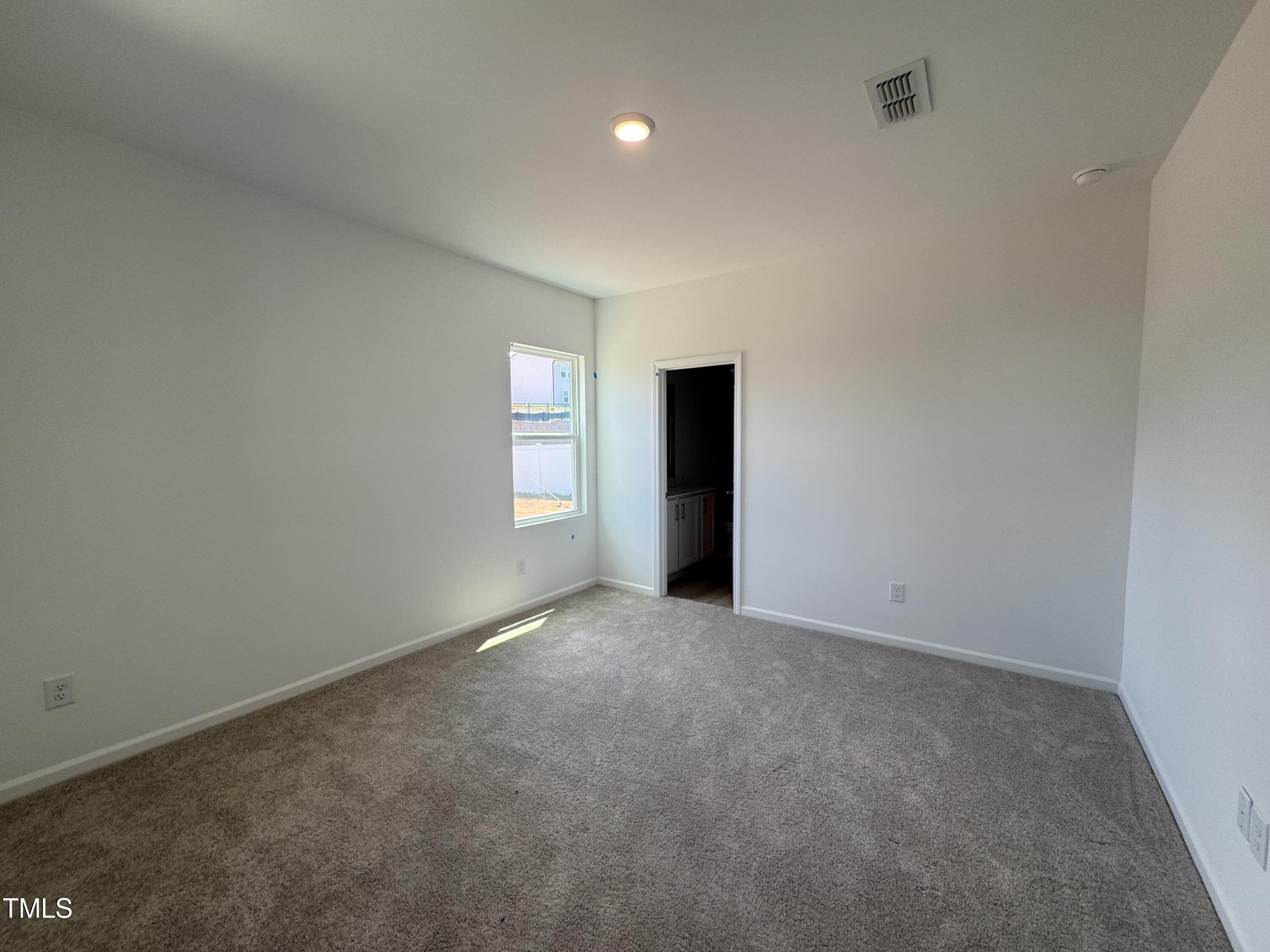 11739 Salers Loop Middlesex, NC 27557 - Photo 4 of 24 a view of an empty room with a window