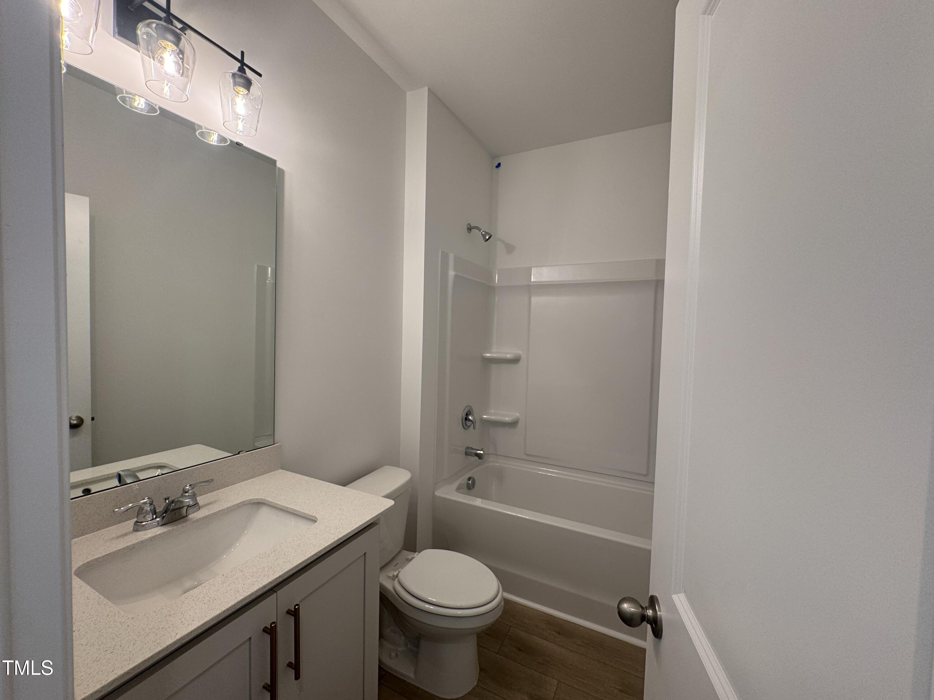 11739 Salers Loop Middlesex, NC 27557 - Photo 5 of 24 a bathroom with a sink toilet tub and shower