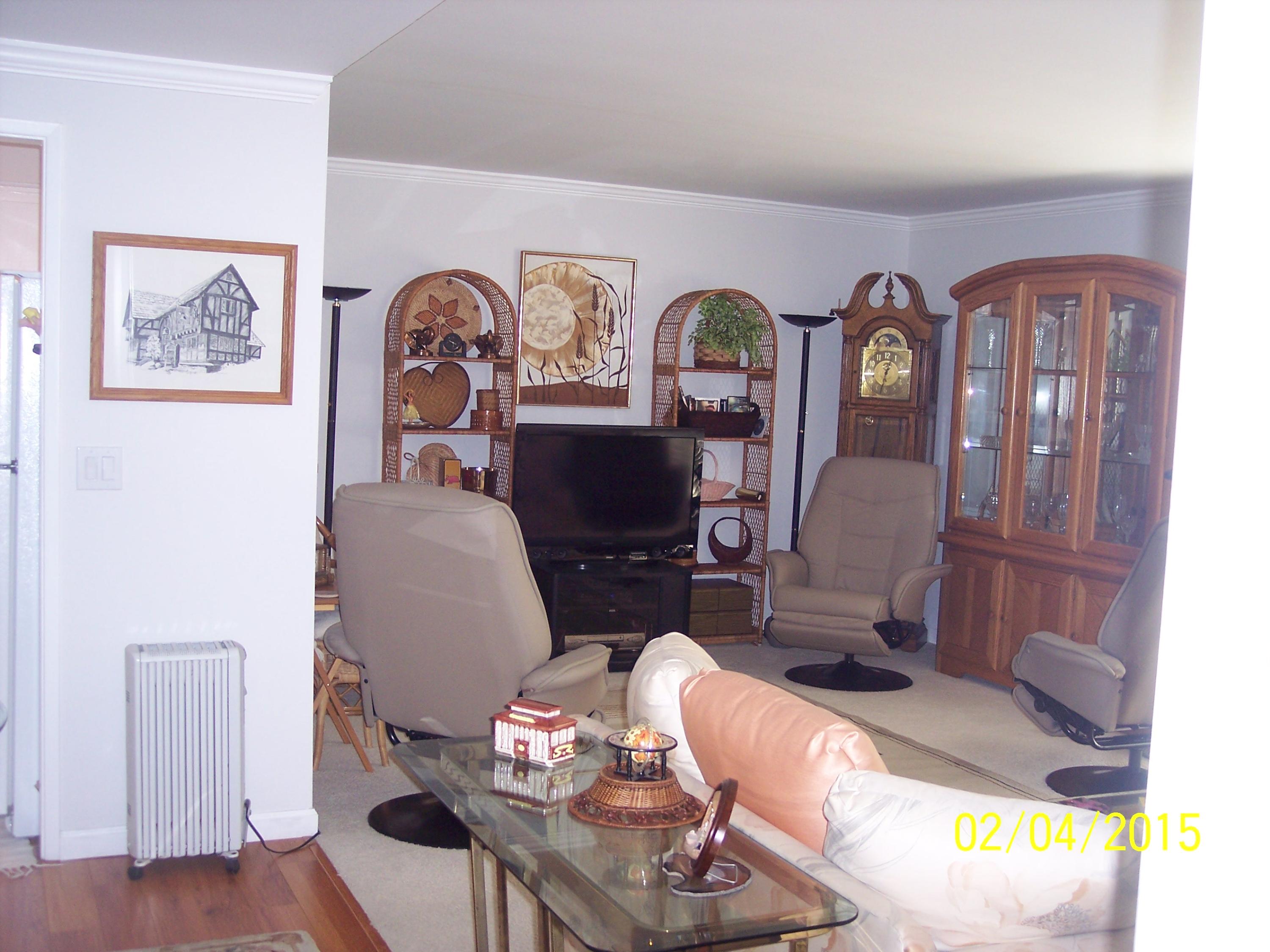 5722 Encina Road, Unit 6 Goleta, CA 93117 - Photo 1 of 22 a living room with furniture and wooden floor