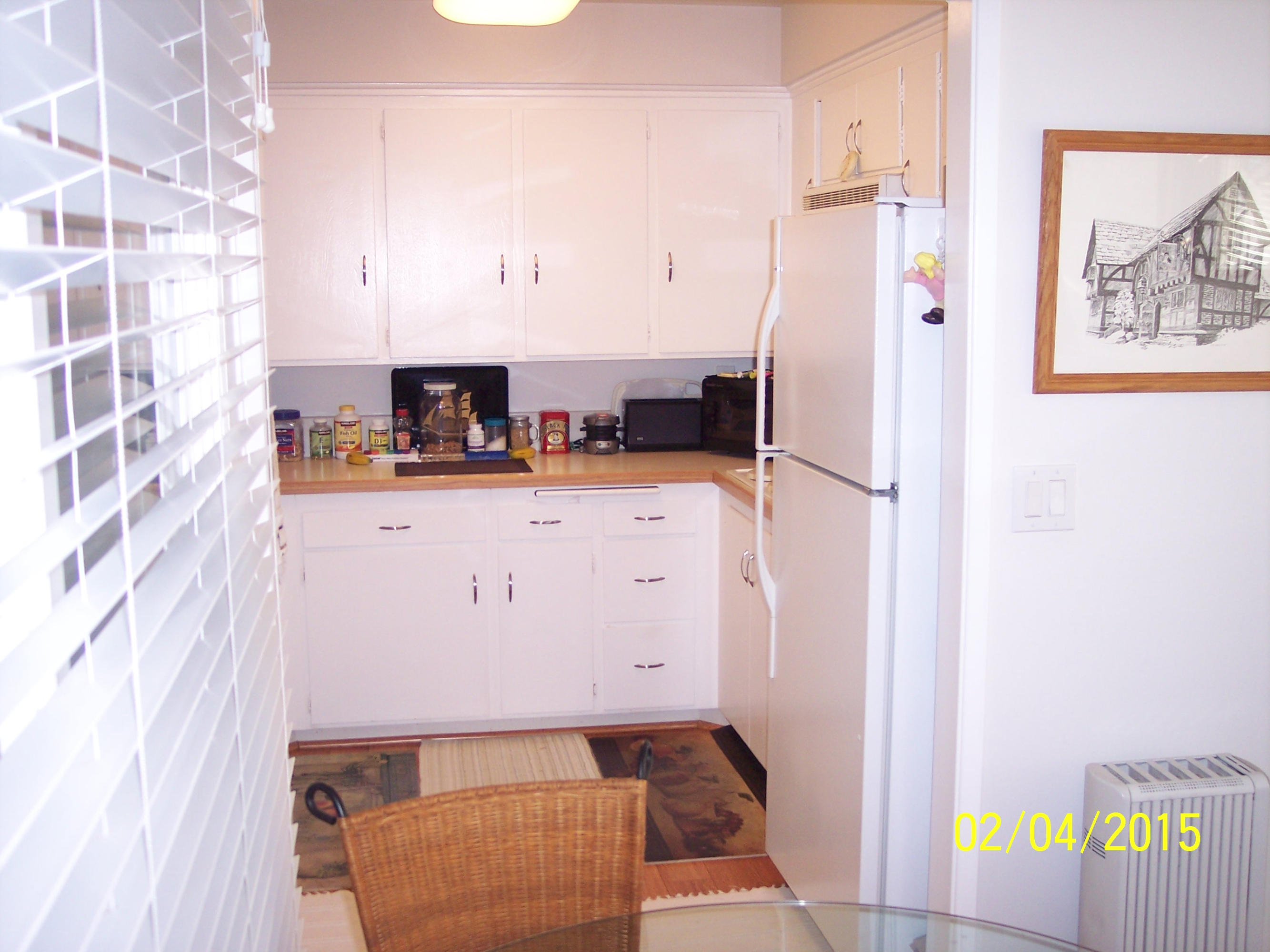 5722 Encina Road, Unit 6 Goleta, CA 93117 - Photo 11 of 22 a view of a kitchen with furniture and a refrigerator