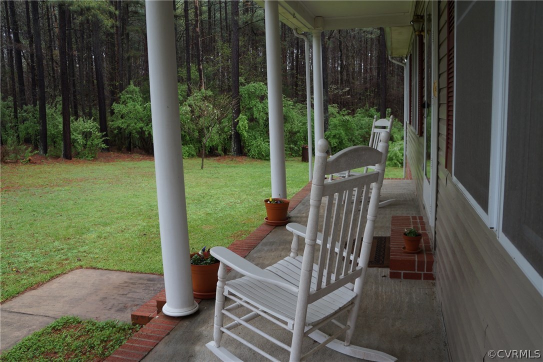 3135 Meherrin Road Meherrin, VA 23954 - Photo 5 of 20 a view of a deck with a table chairs and backyard