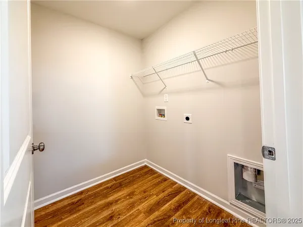 a view of an empty room and fire place