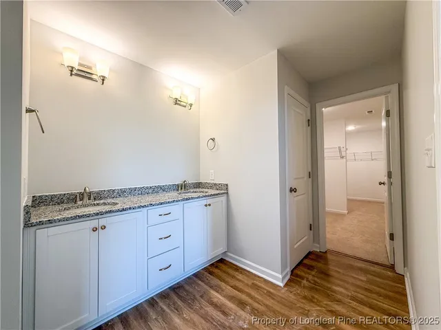 en empty room with windows and closet