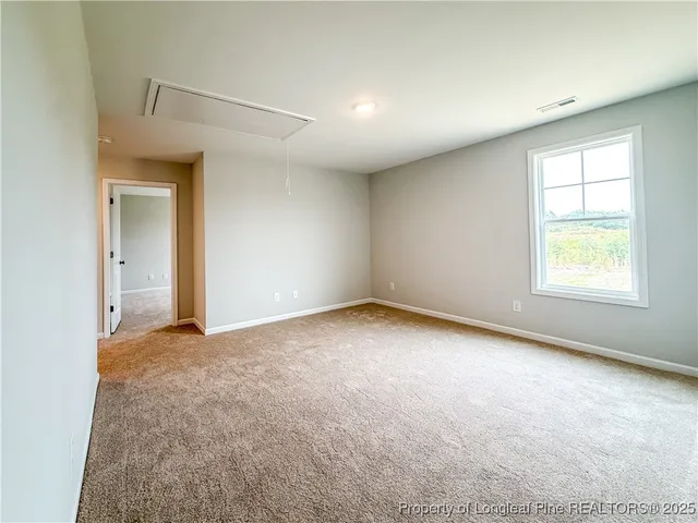 a spacious bathroom with a granite countertop sink and a mirror