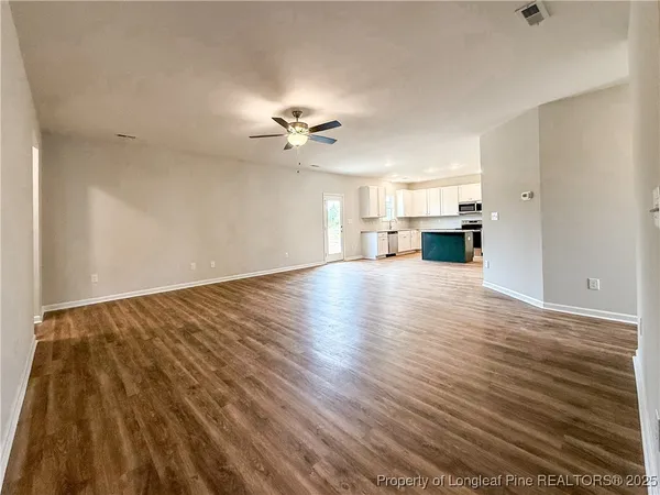 a view of kitchen with wooden floor