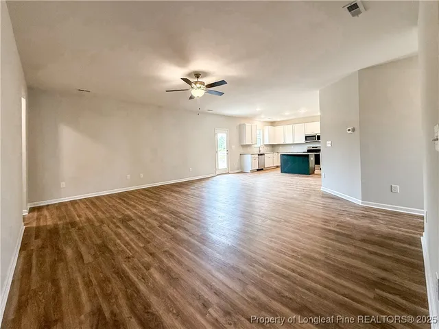 a view of kitchen with wooden floor