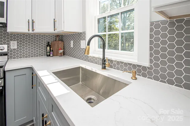 a kitchen with a sink and a window