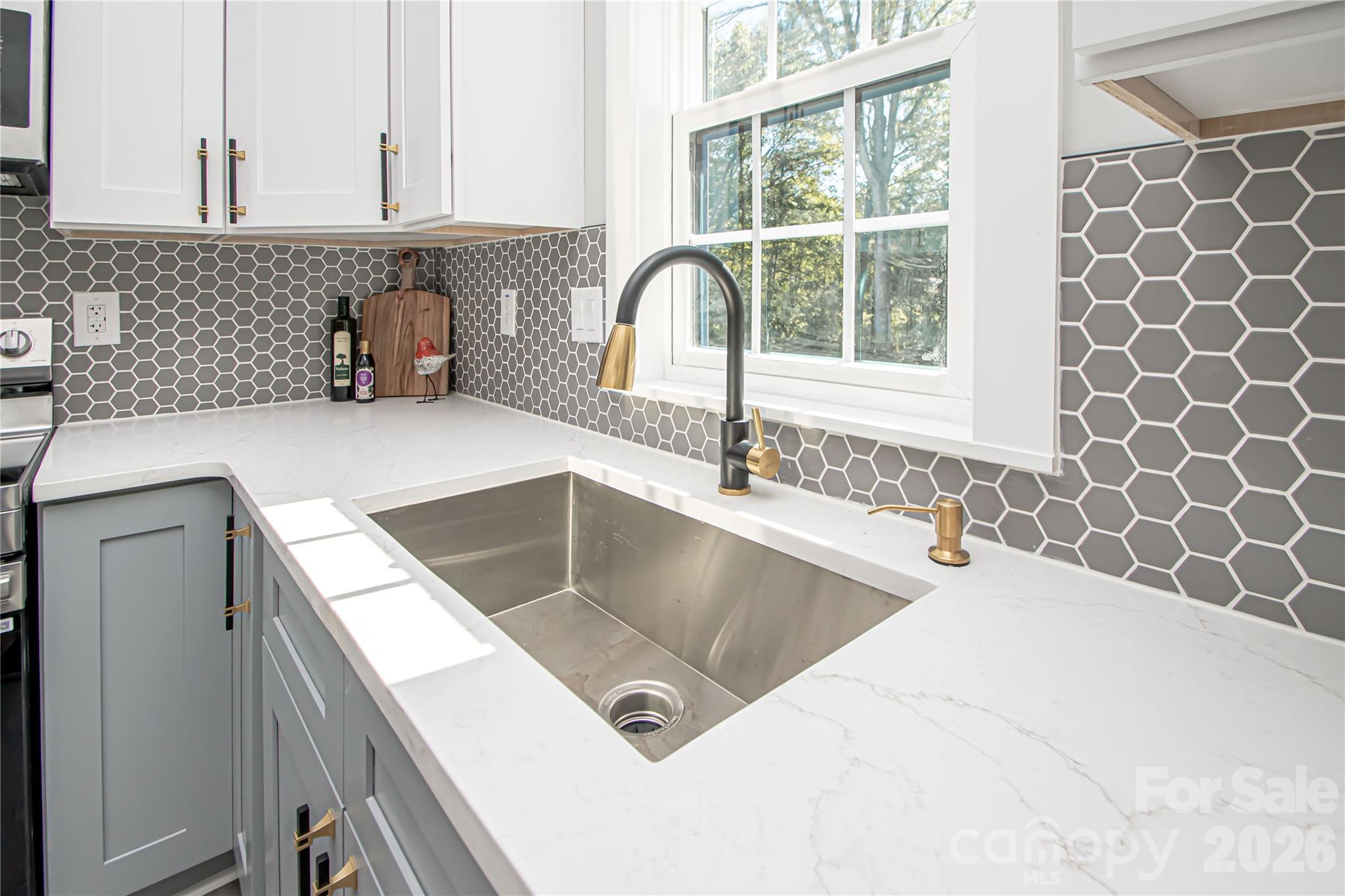 728 Sugar Plum Road Chester, SC 29706 - Photo 13 of 47 a kitchen with a sink and a window