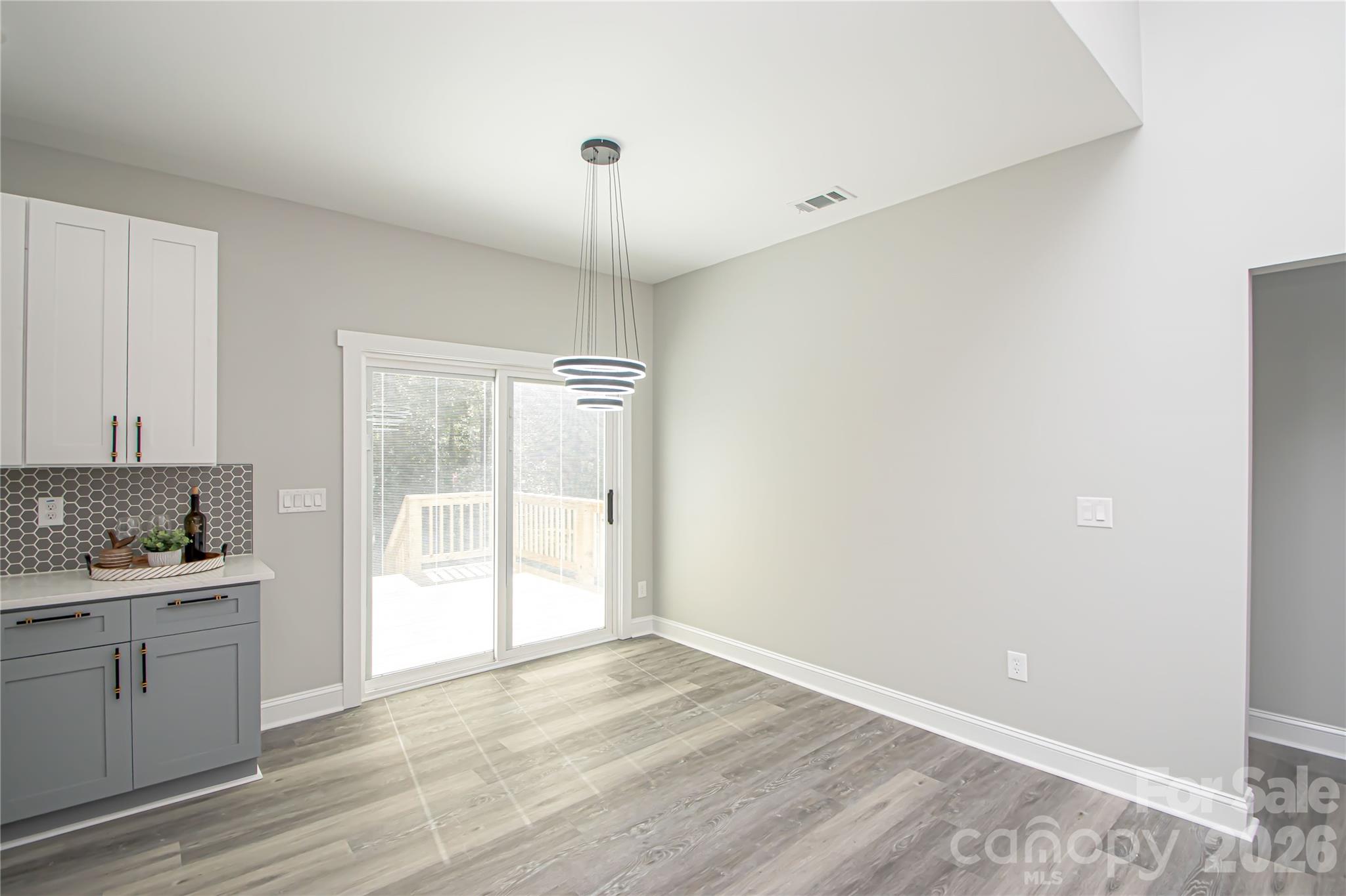 728 Sugar Plum Road Chester, SC 29706 - Photo 15 of 47 a view of a kitchen with a sink and dishwasher with wooden floor