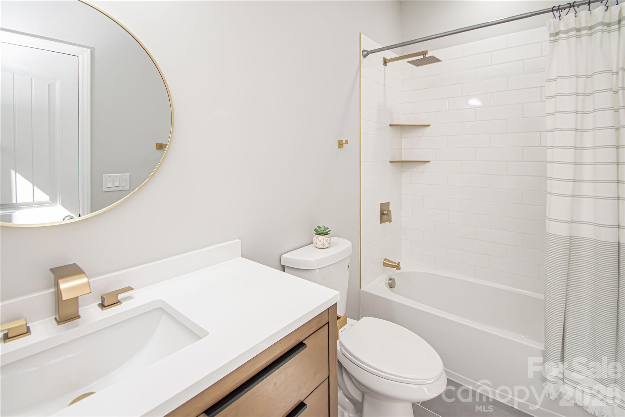 728 Sugar Plum Road Chester, SC 29706 - Photo 21 of 47 a bathroom with a sink toilet vanity and shower