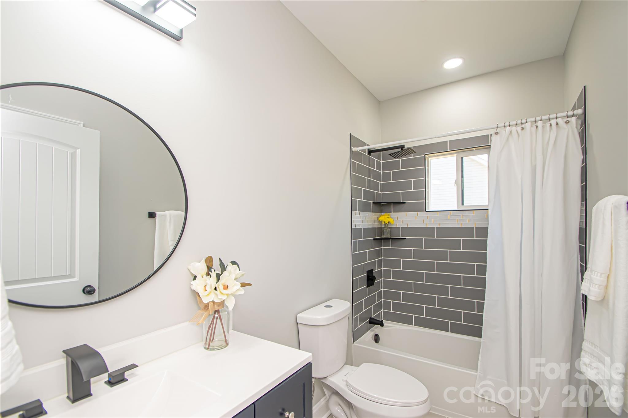 728 Sugar Plum Road Chester, SC 29706 - Photo 28 of 47 a bathroom with a sink a toilet and shower