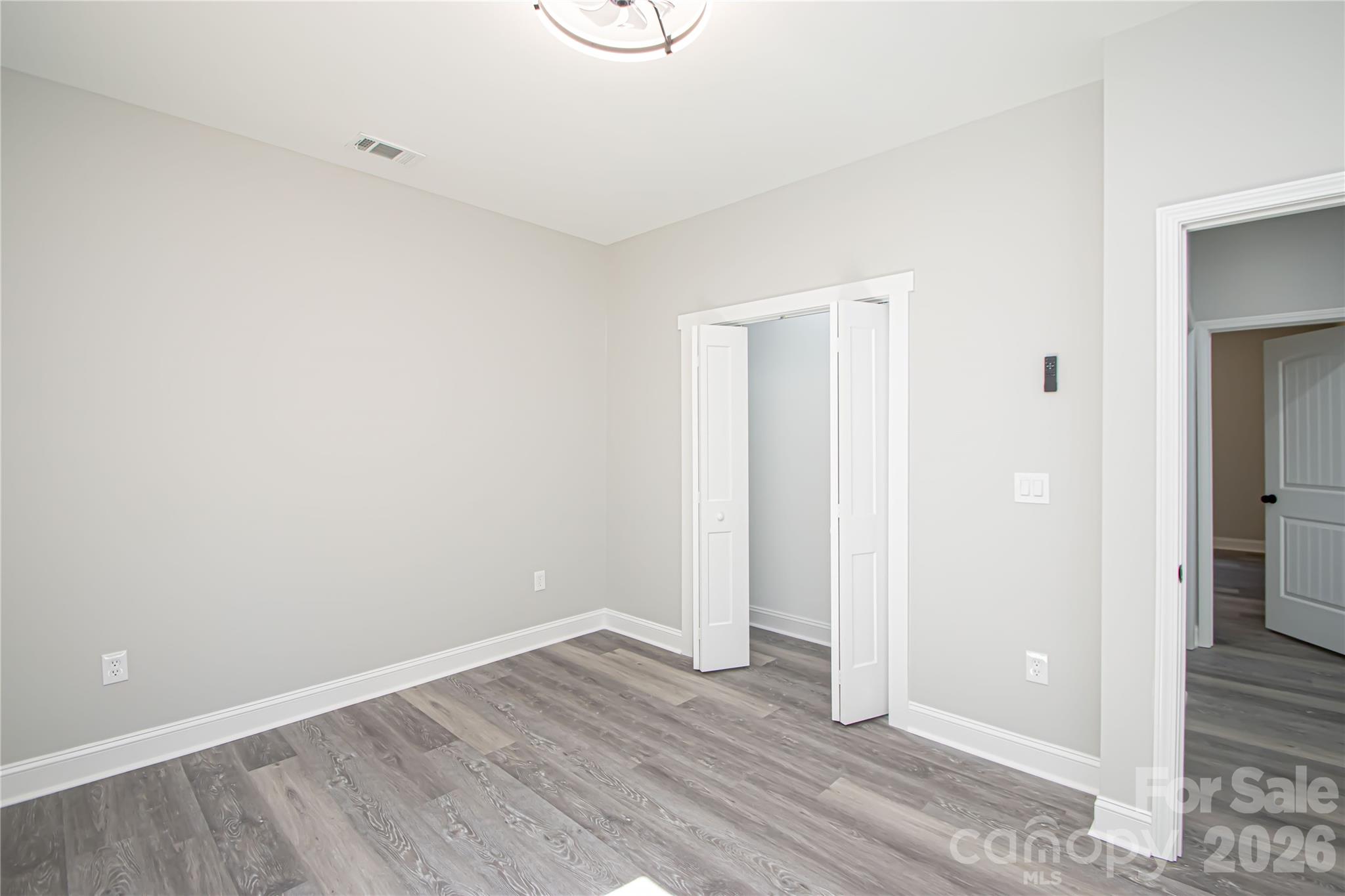 728 Sugar Plum Road Chester, SC 29706 - Photo 29 of 47 a view of an empty room with wooden floor and a window
