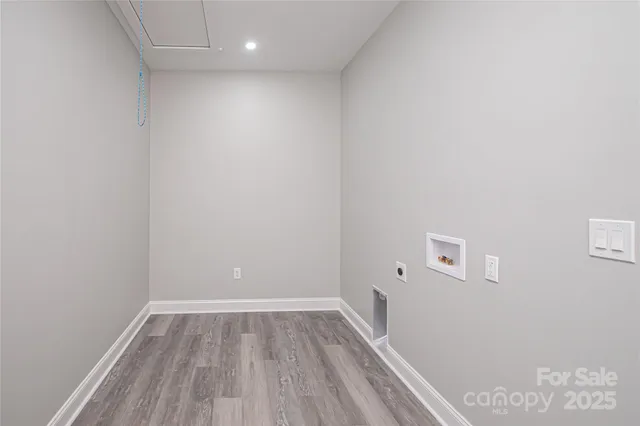 a view of room with window and hardwood floor