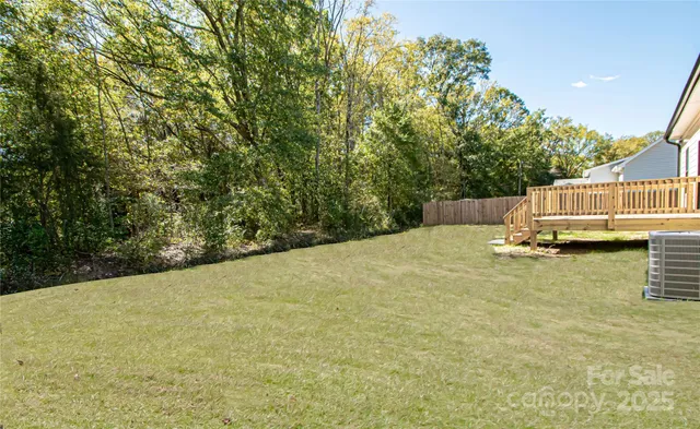 a view of a house with a yard and garage