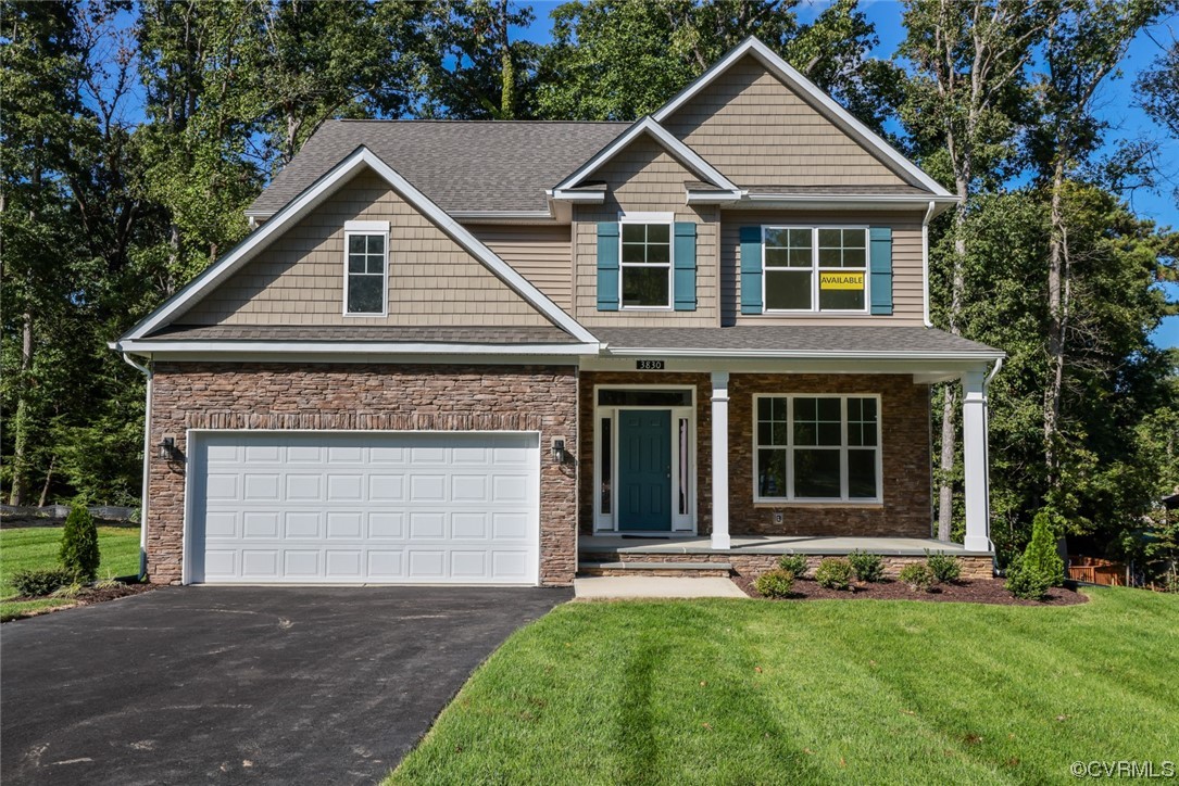 3830 Belspring Road Chester, VA 23831 - Photo 1 of 43 a front view of a house with a yard and garage