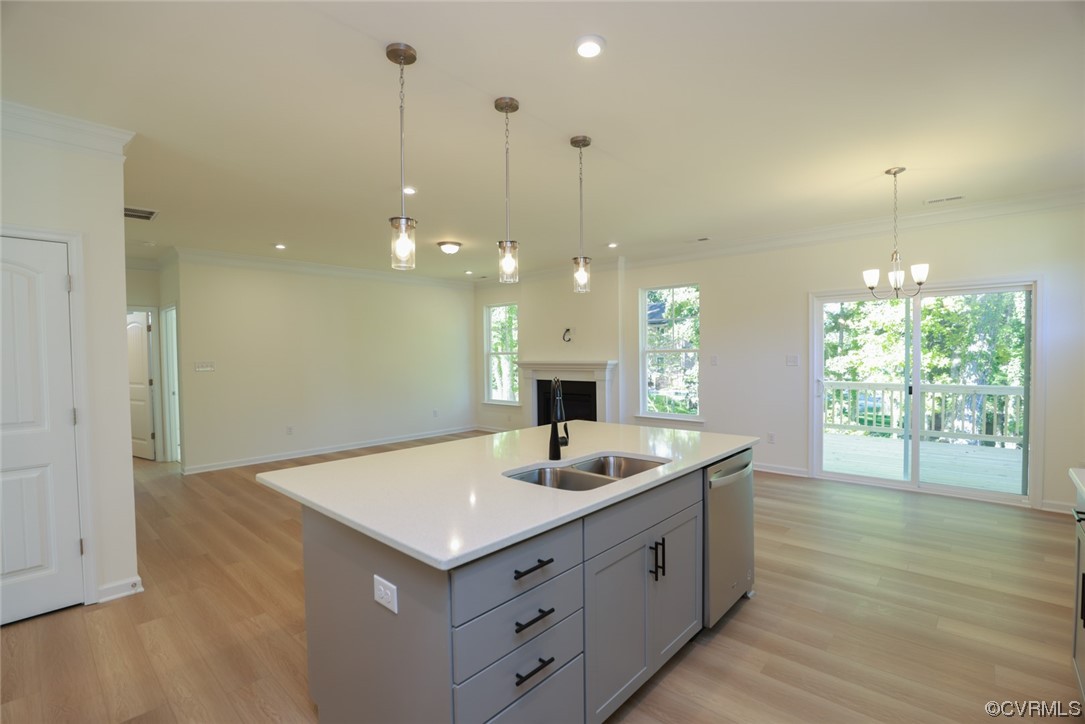 3830 Belspring Road Chester, VA 23831 - Photo 12 of 43 a kitchen with a sink chandelier and wooden floor