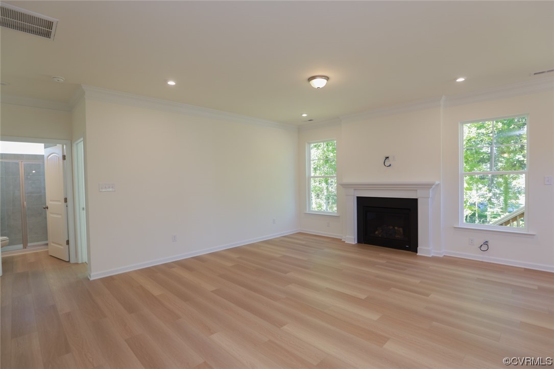 3830 Belspring Road Chester, VA 23831 - Photo 15 of 43 an empty room with windows and fireplace