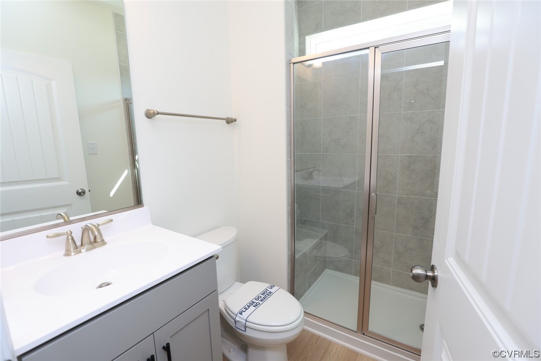 3830 Belspring Road Chester, VA 23831 - Photo 18 of 43 a bathroom with a sink a toilet and shower