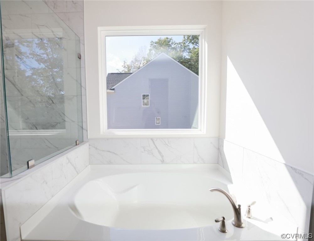 3830 Belspring Road Chester, VA 23831 - Photo 23 of 43 a bathroom with a tub and shower