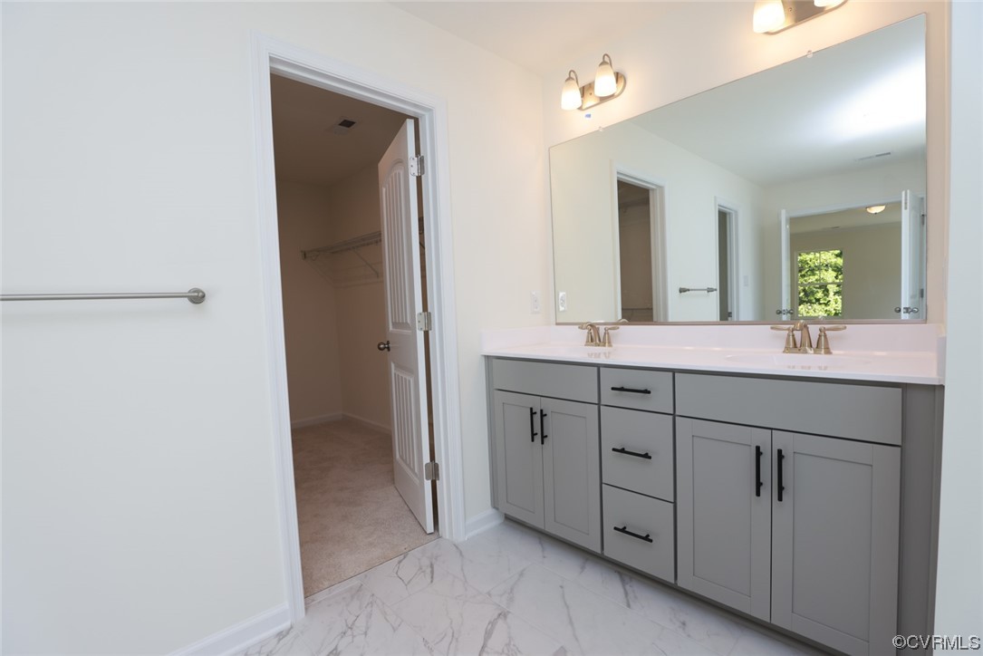 3830 Belspring Road Chester, VA 23831 - Photo 25 of 43 a bathroom with a double vanity sink and mirror