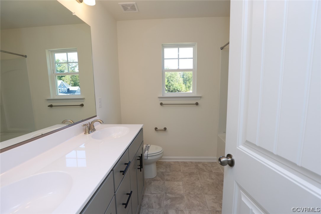 3830 Belspring Road Chester, VA 23831 - Photo 29 of 43 a bathroom with a sink and a vanity