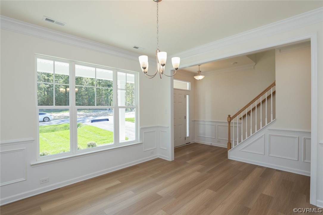3830 Belspring Road Chester, VA 23831 - Photo 4 of 43 a view of an empty room with wooden floor and a window