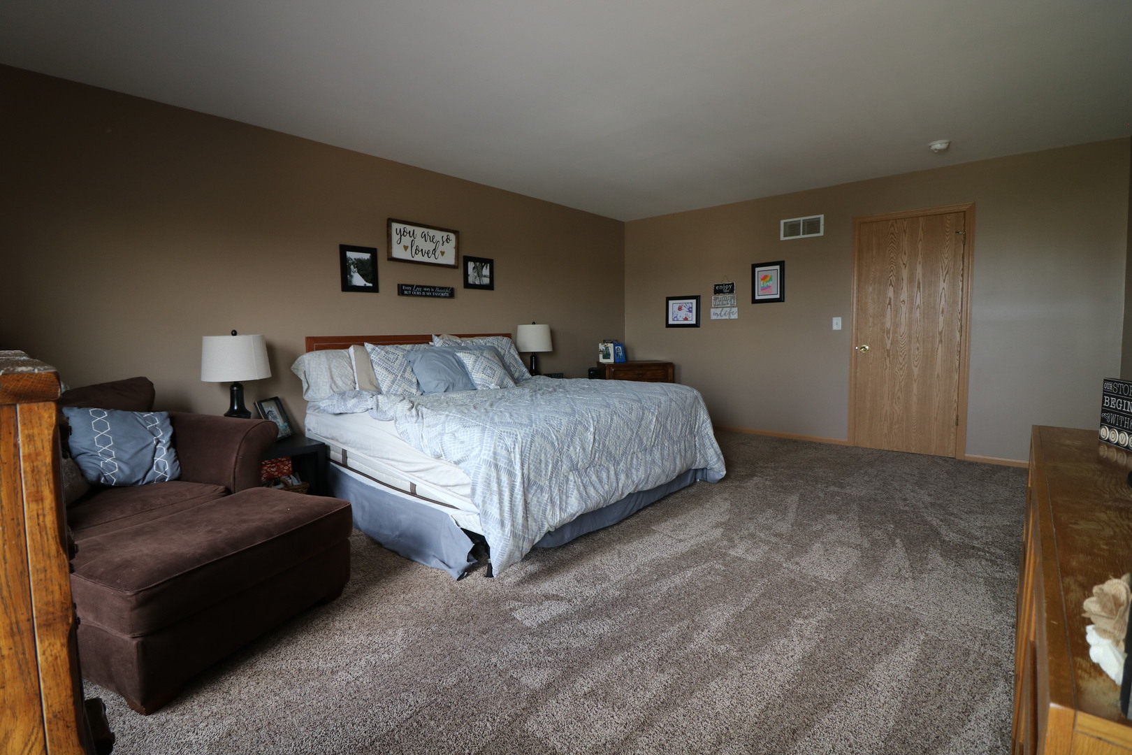 25269 Faraday Road Manhattan, IL 60442 - Photo 14 of 17 a bedroom with a bed couch and painting on the wall