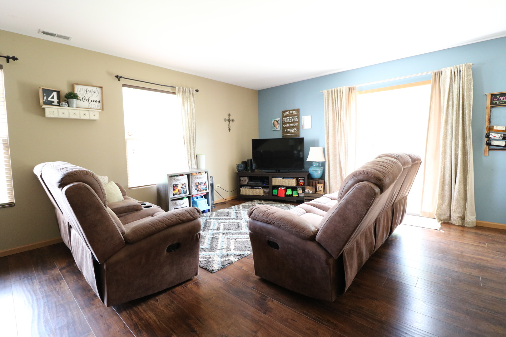 25269 Faraday Road Manhattan, IL 60442 - Photo 3 of 17 a living room with furniture a window and wooden floor