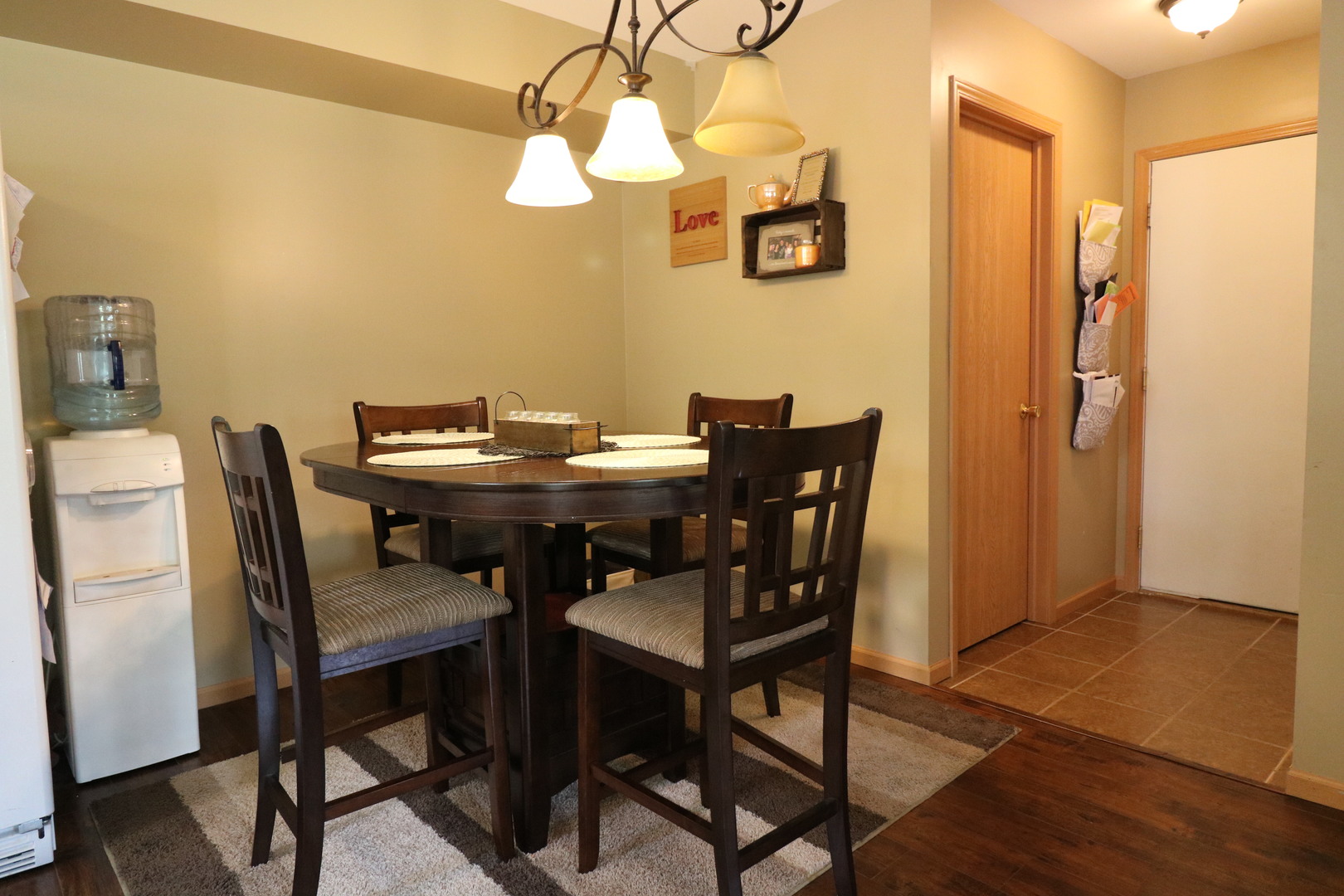 25269 Faraday Road Manhattan, IL 60442 - Photo 7 of 17 a view of a dining room with furniture and wooden floor