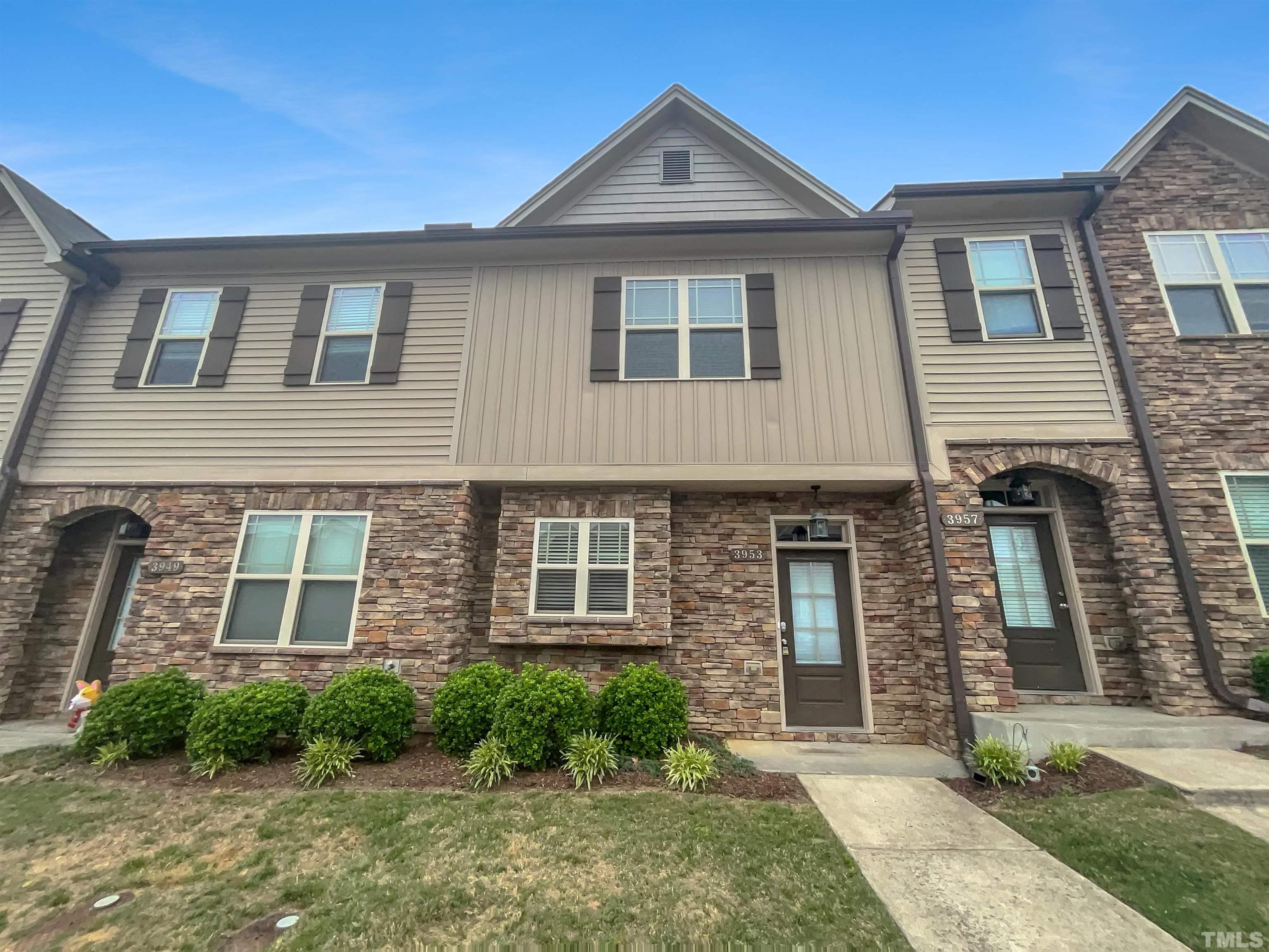 3953 Amelia Park Drive Raleigh, NC 27606 - Photo 1 of 17 a front view of a house with garden