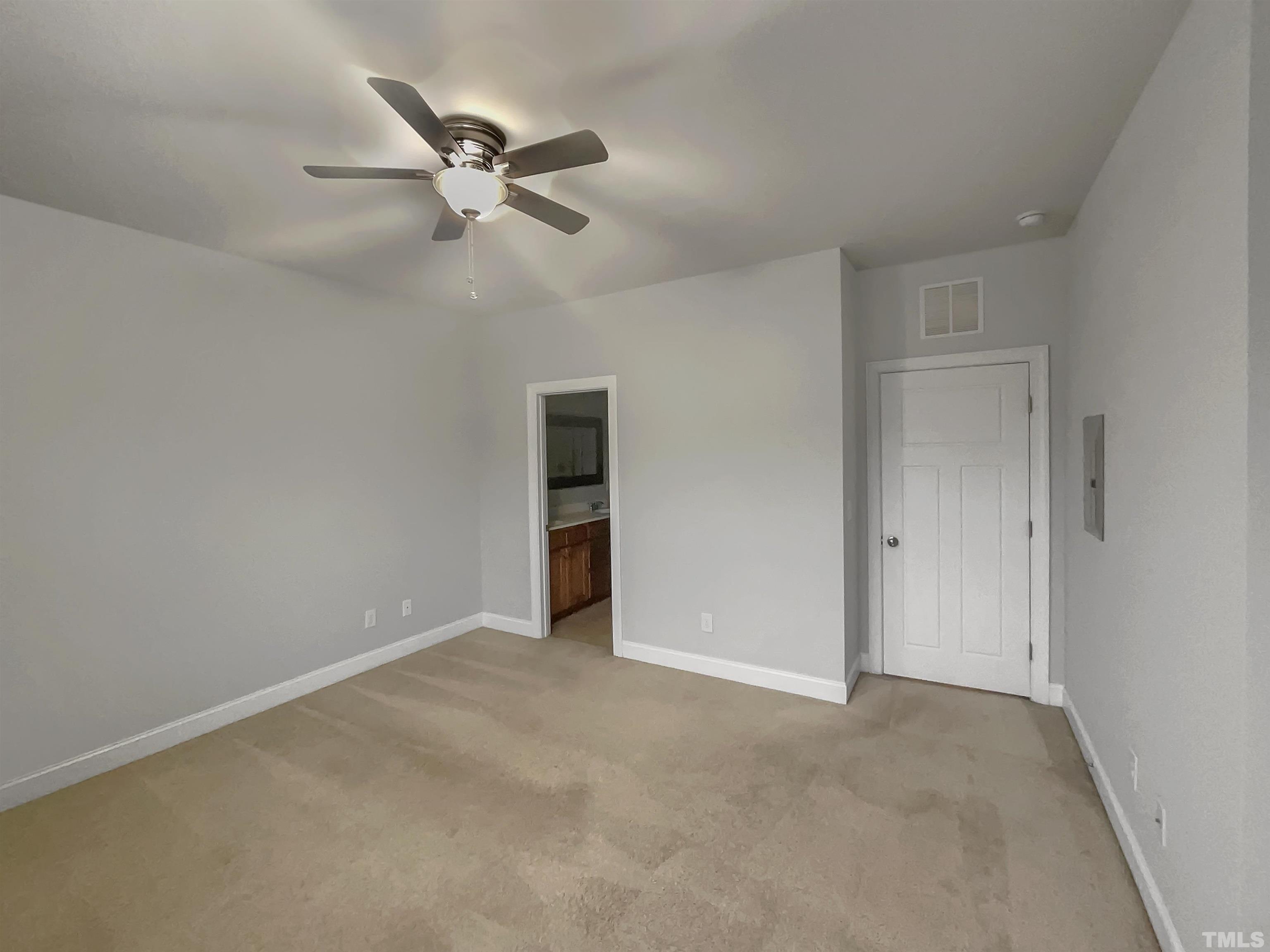 3953 Amelia Park Drive Raleigh, NC 27606 - Photo 12 of 17 a view of an empty room with a ceiling fan