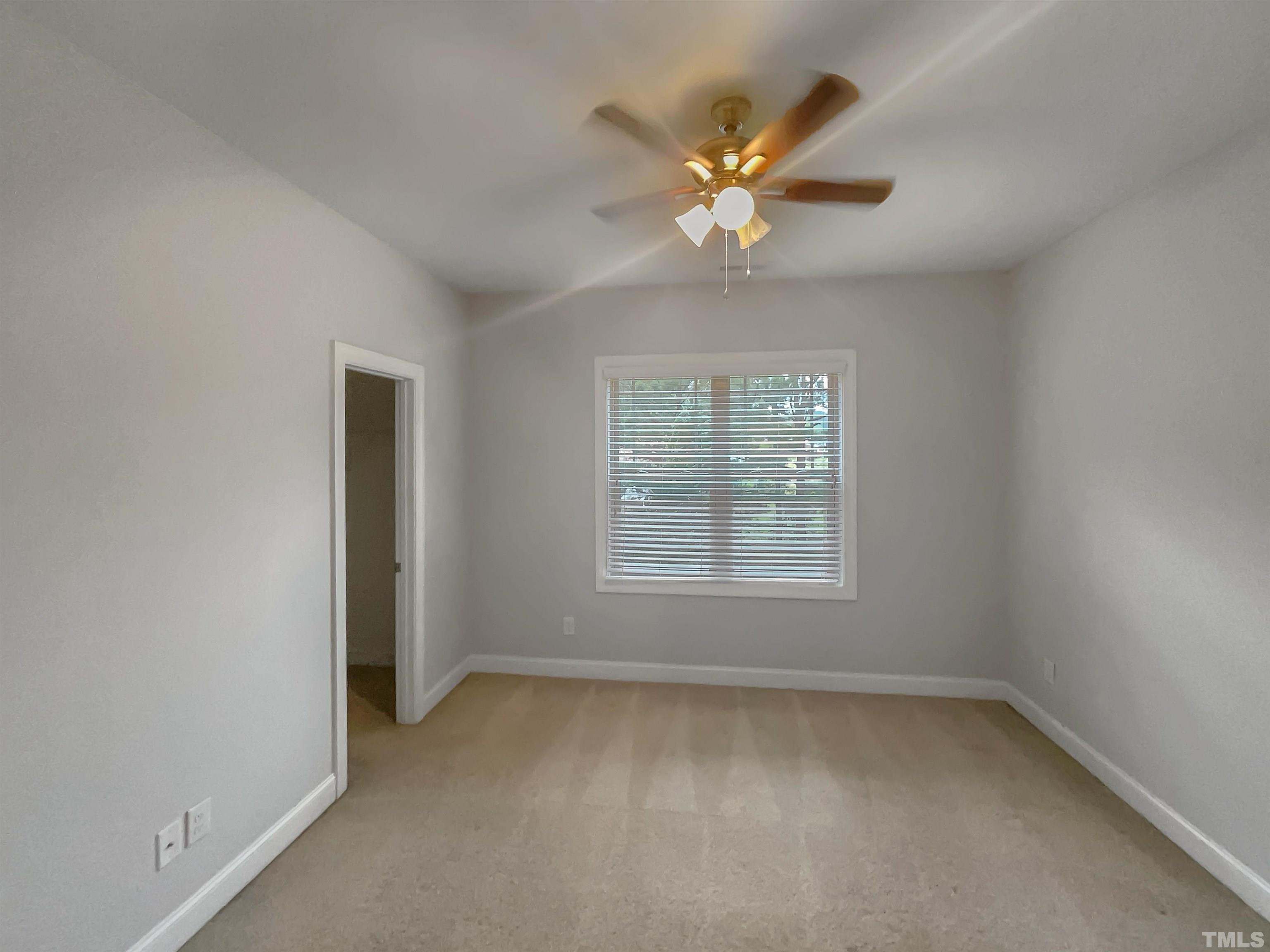 3953 Amelia Park Drive Raleigh, NC 27606 - Photo 14 of 17 a view of an empty room with a window