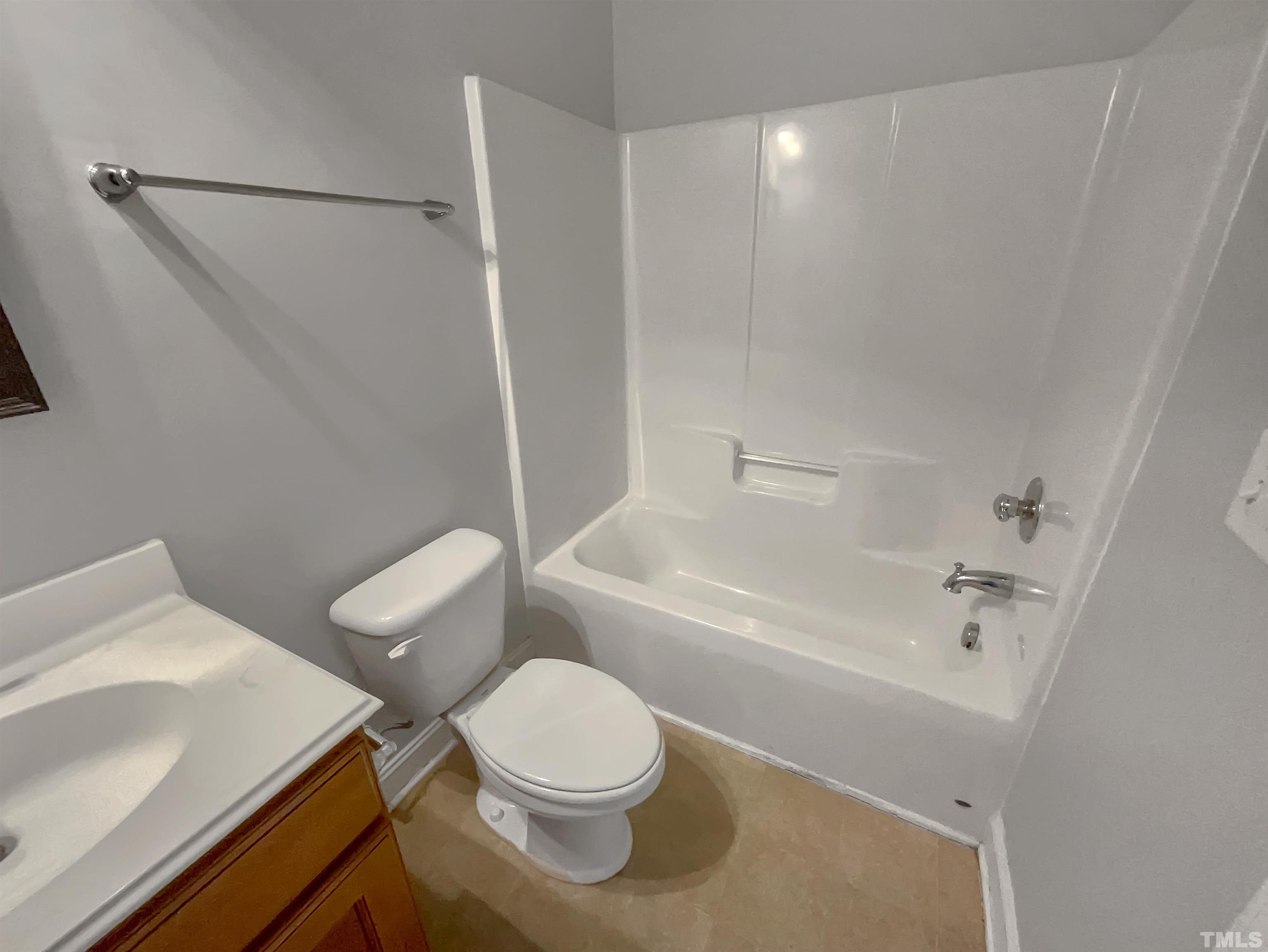 3953 Amelia Park Drive Raleigh, NC 27606 - Photo 16 of 17 a bathroom with a toilet and a sink