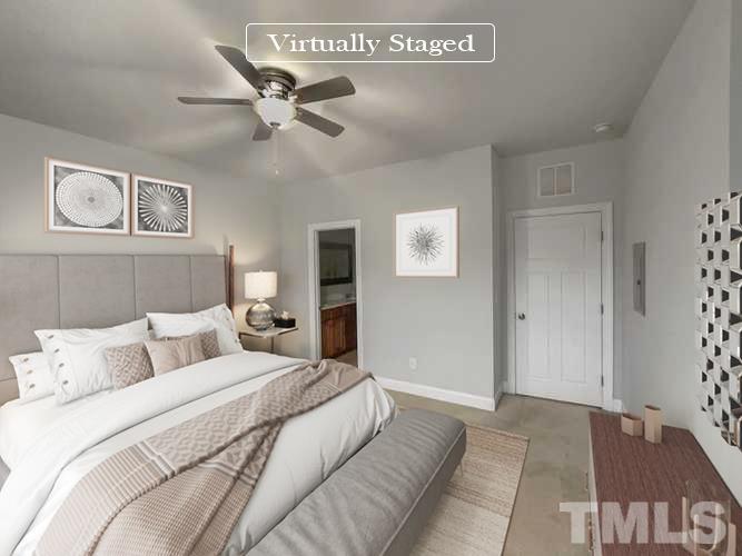 3953 Amelia Park Drive Raleigh, NC 27606 - Photo 3 of 17 a bedroom with a bed and window