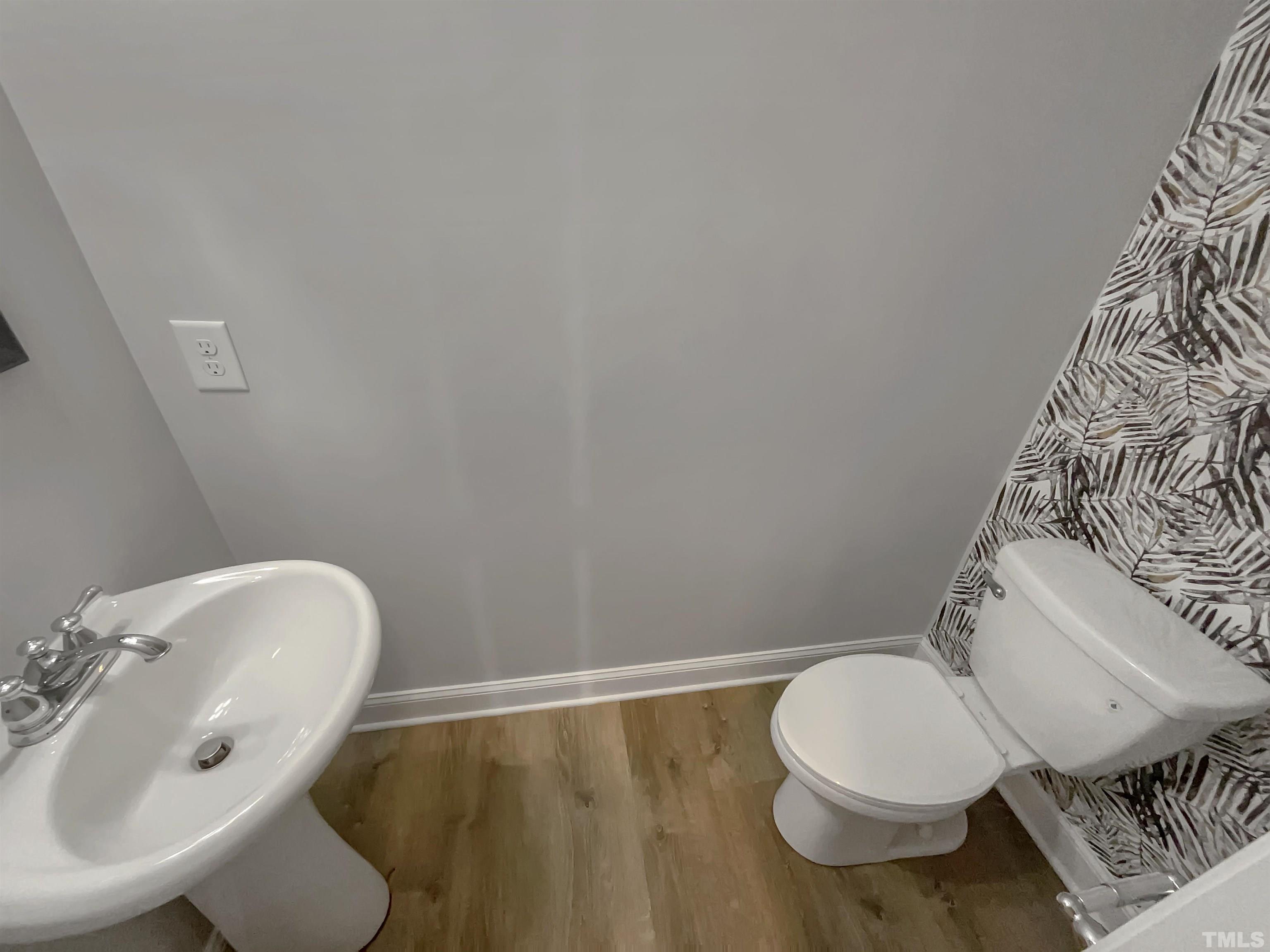 3953 Amelia Park Drive Raleigh, NC 27606 - Photo 10 of 17 a bathroom with a toilet and a sink