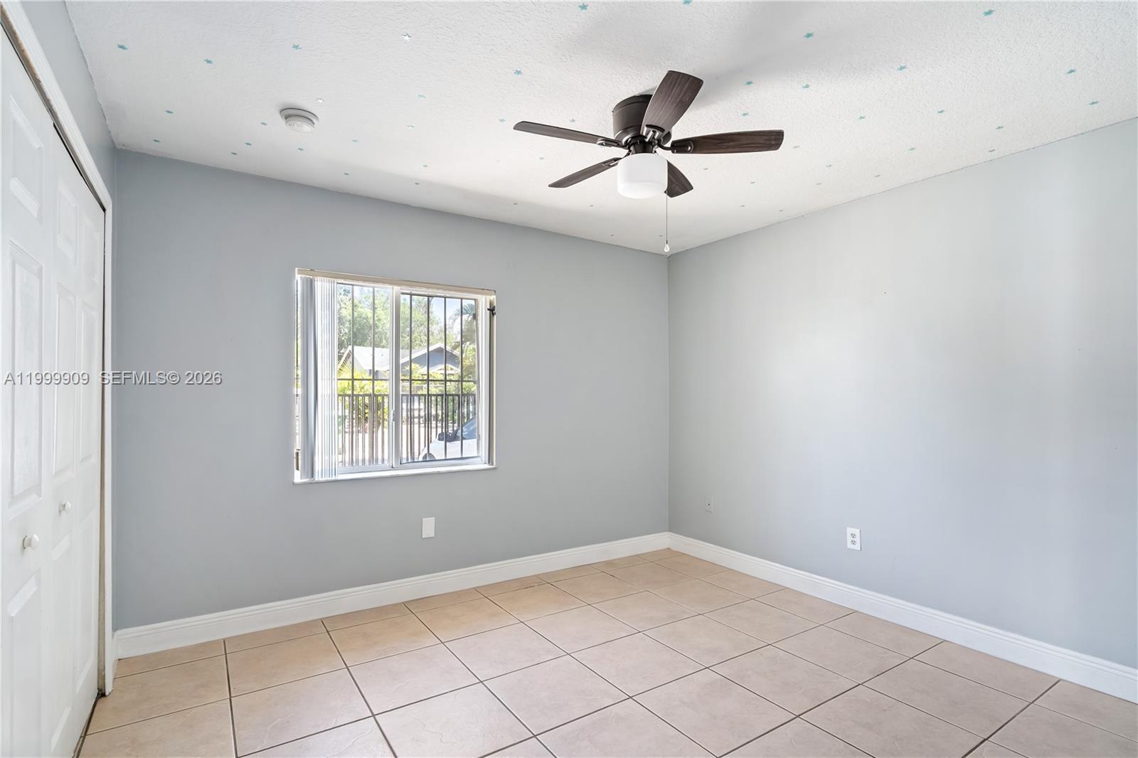 760 Northwest 80th Street, Unit 760 Miami, FL 33150 - Photo 14 of 32 a view of empty room with ceiling fan