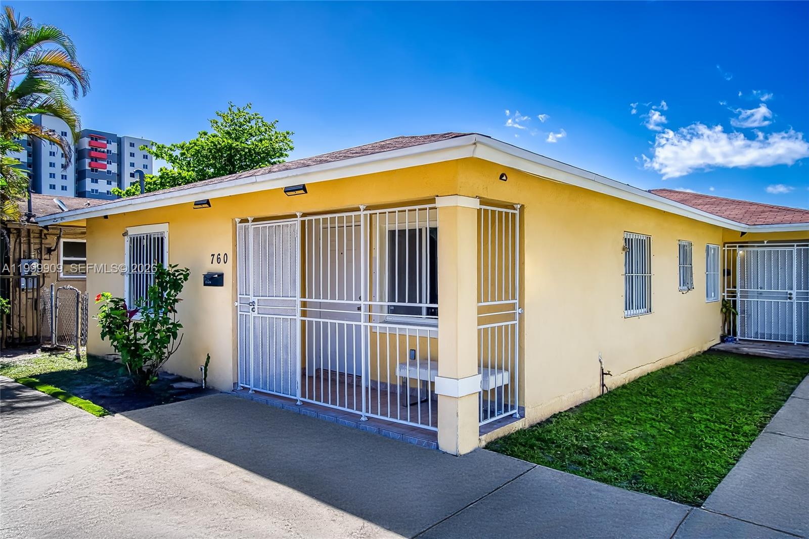 760 Northwest 80th Street, Unit 760 Miami, FL 33150 - Photo 21 of 32 a front view of a house with garden