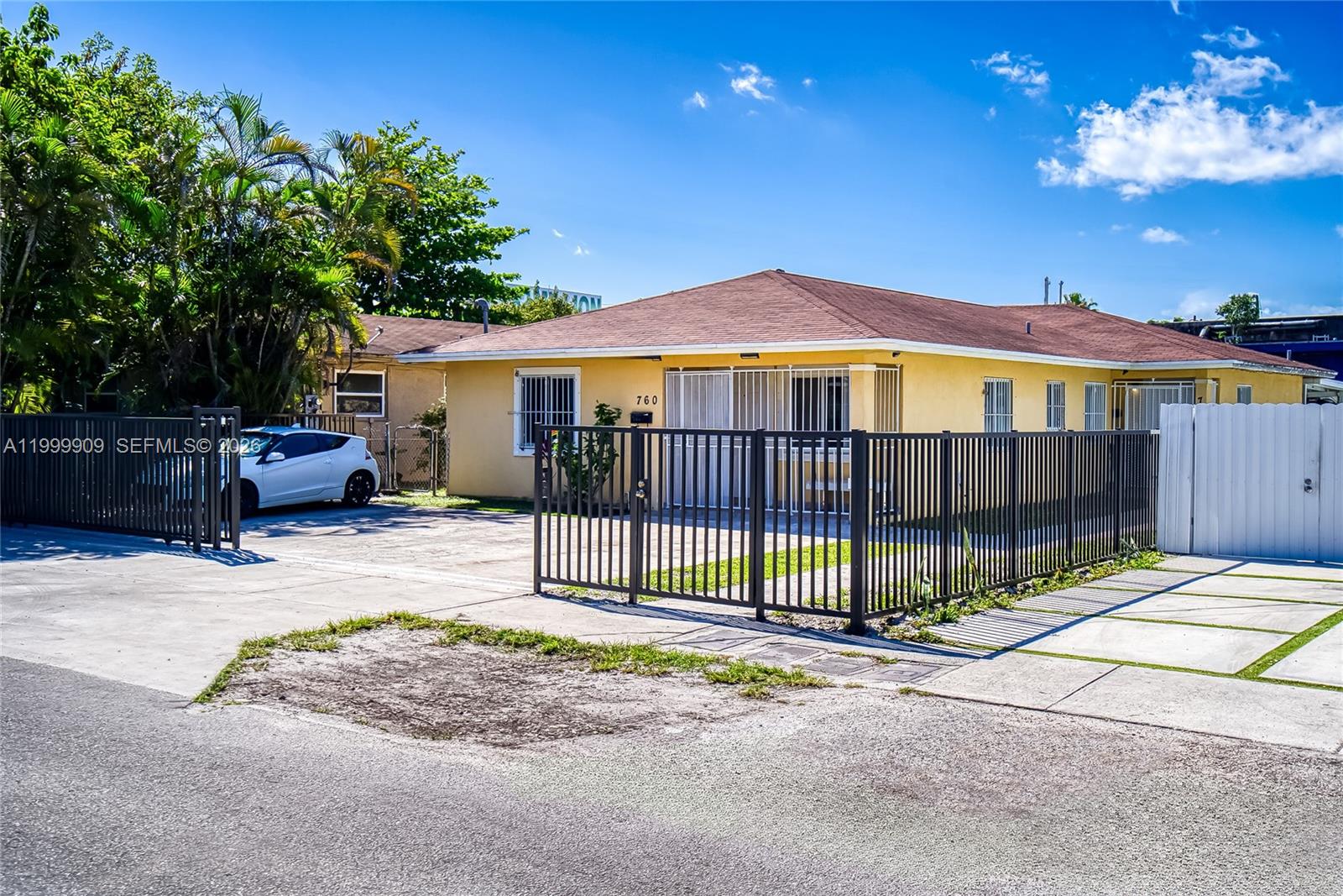 760 Northwest 80th Street, Unit 760 Miami, FL 33150 - Photo 23 of 32 a backyard of a house with barbeque oven and outdoor seating