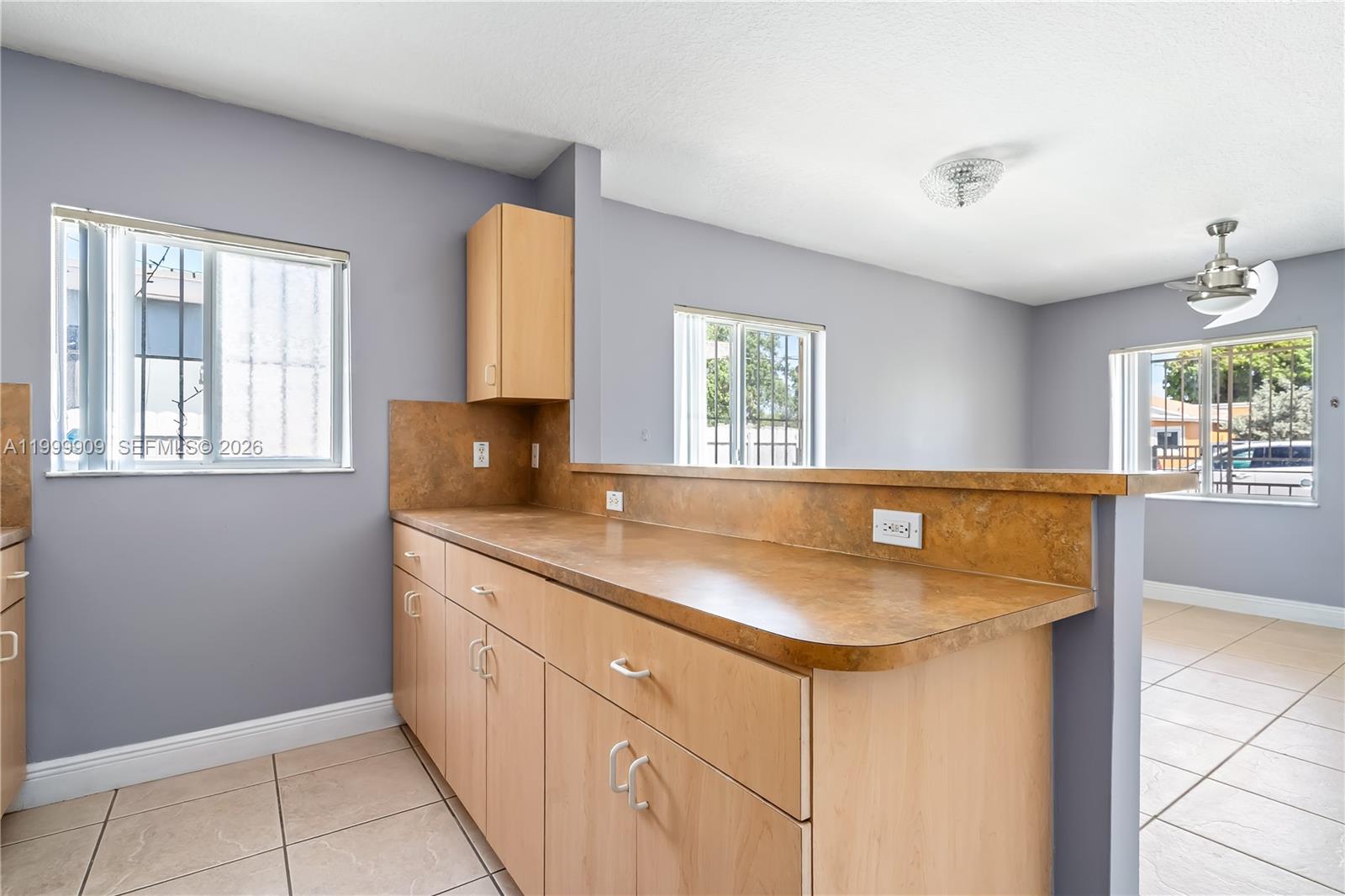 760 Northwest 80th Street, Unit 760 Miami, FL 33150 - Photo 5 of 32 a kitchen with a sink and a window