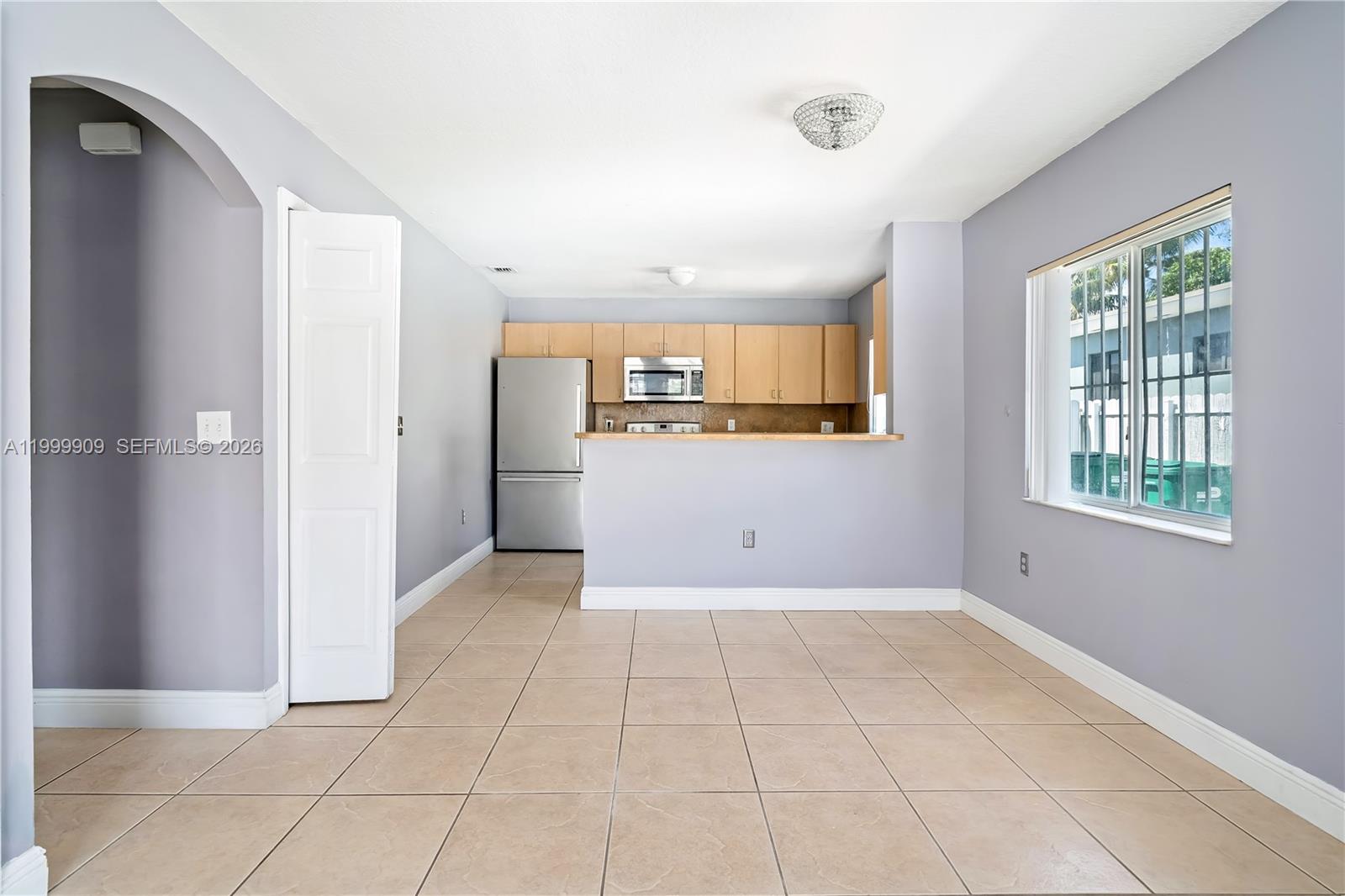 760 Northwest 80th Street, Unit 760 Miami, FL 33150 - Photo 6 of 32 a view of a kitchen with a sink and a window
