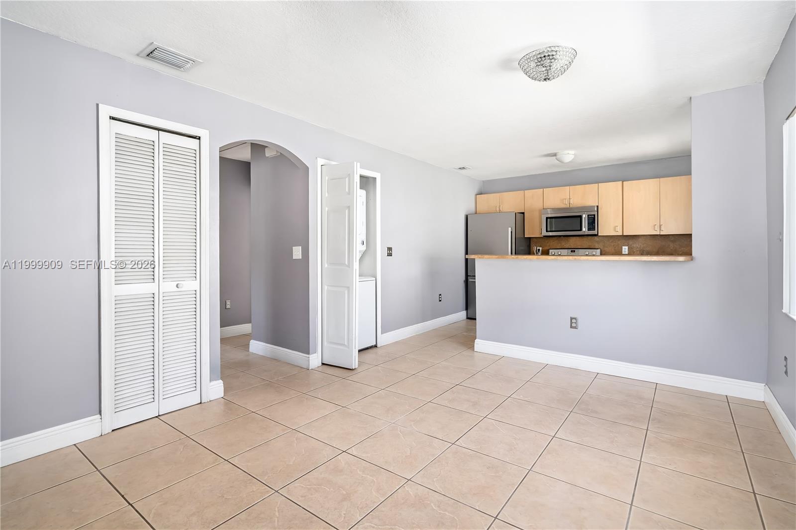 760 Northwest 80th Street, Unit 760 Miami, FL 33150 - Photo 7 of 32 a view of a sink and a refrigerator in a room