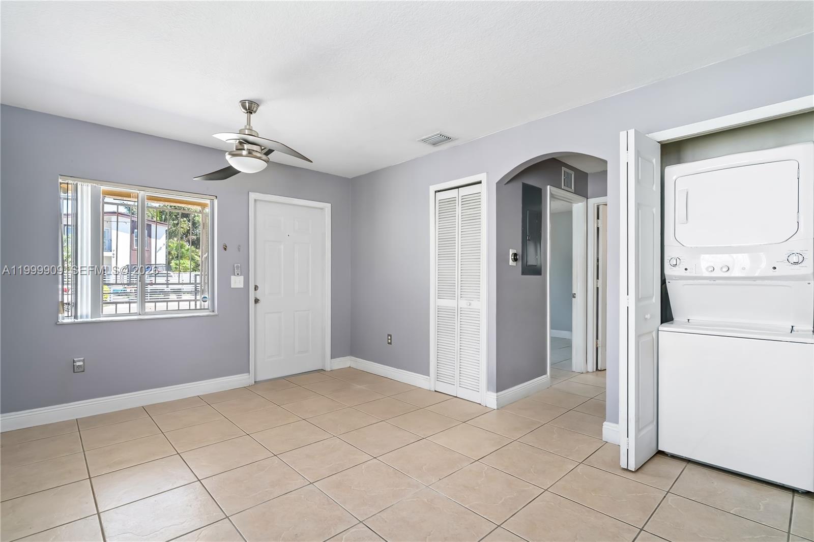 760 Northwest 80th Street, Unit 760 Miami, FL 33150 - Photo 8 of 32 a view of an empty room with window and cabinet